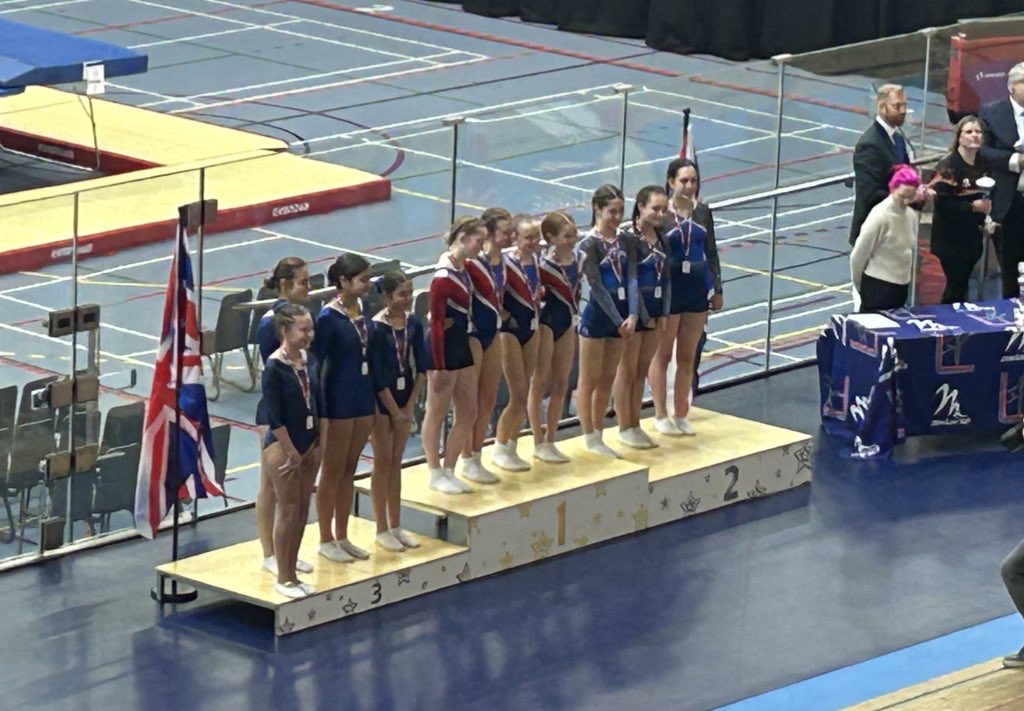 Photo of trampolinists on the podium
