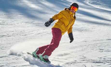 Stock photo of a young woman skiing