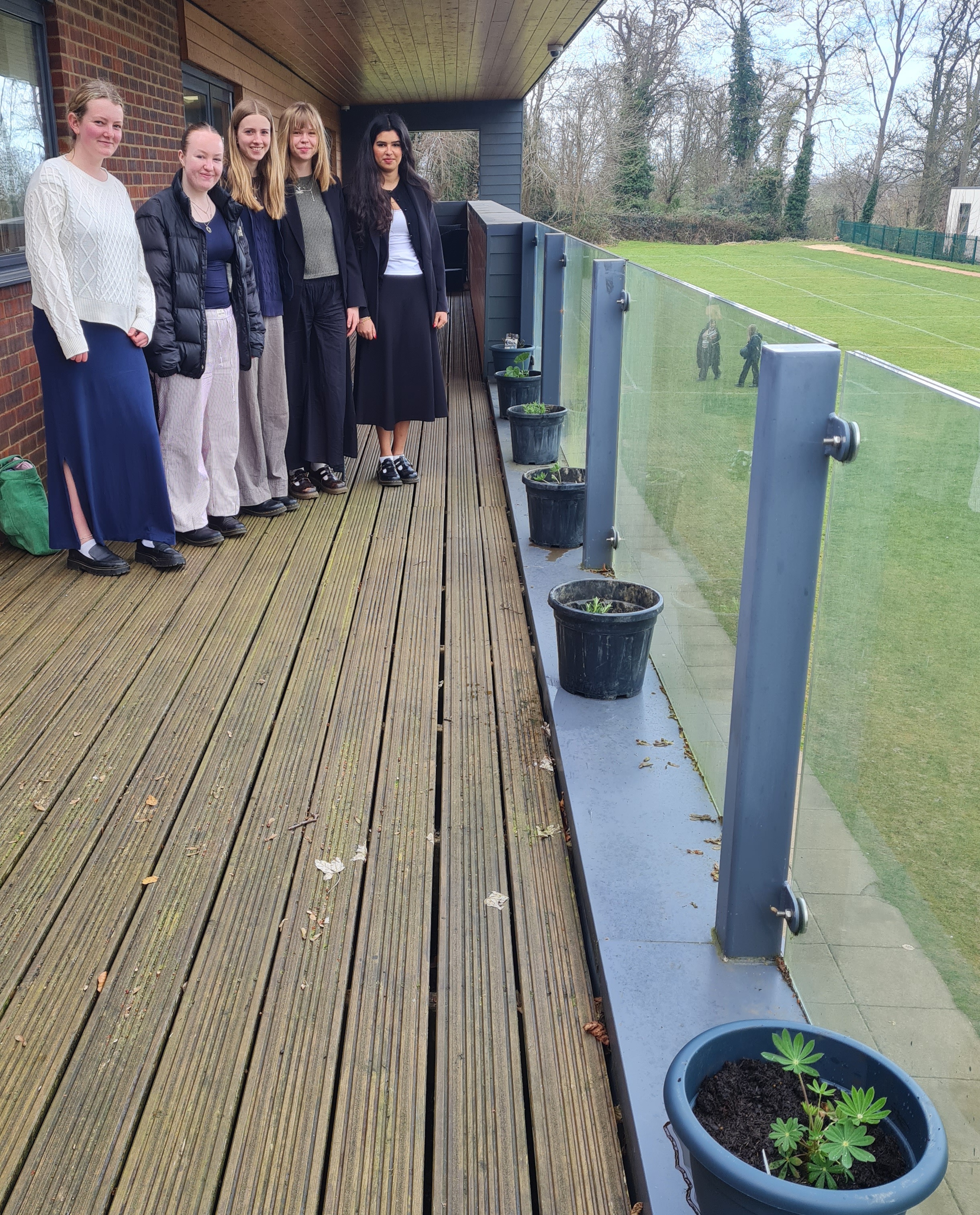 Photo of Sixth Formers on the balcony with planters